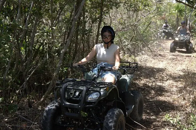 ATV rider entering a mangrove trail in Isla Blanca