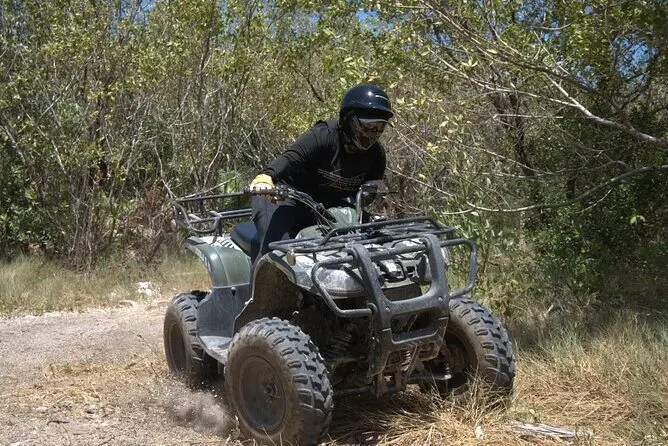 Guests enjoying an ATV ride through Isla Blanca